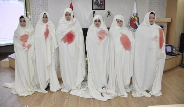 Kanlı kefen giyip kadına şiddete tepki gösterdiler